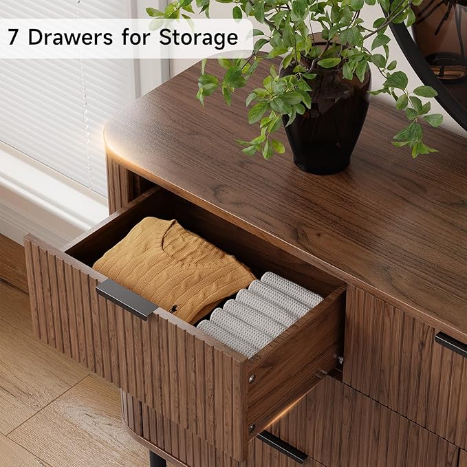 Fluted Dresser for Bedroom with 7 Drawers, 60 Inch Wide Modern Chest of Drawers with Metal Handle, Curved Profile Design, Wood Dresser TV Stand for Bedroom, Living Room, Hallway, Walnut